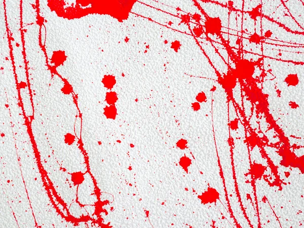 Beyaz arka planda kırmızı leke ve sıçrama boya