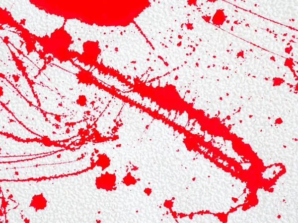 Beyaz arka planda kırmızı leke ve sıçrama boya