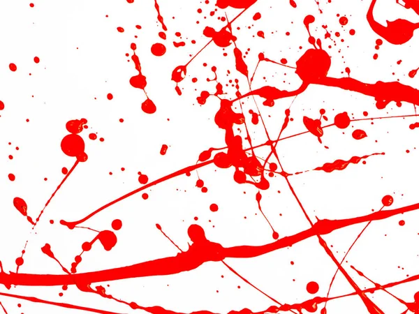 Goccioline di vernice rossa e spruzzi su sfondo bianco — Foto Stock
