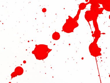 beyaz zemin üzerine kırmızı boya damlar