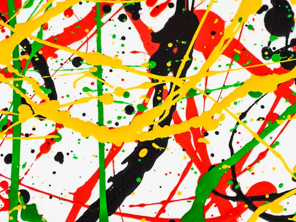 Art splashed spilled yellow green red black paint. expressionism. — Stock Photo, Image