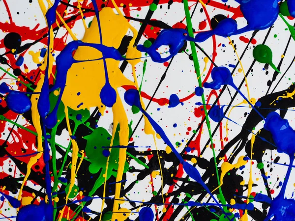 Abstract expressionisme kunst creatieve achtergrond. kunst van spatten en druppelt. rood zwart groen geel blauw verf op witte achtergrond. — Stockfoto