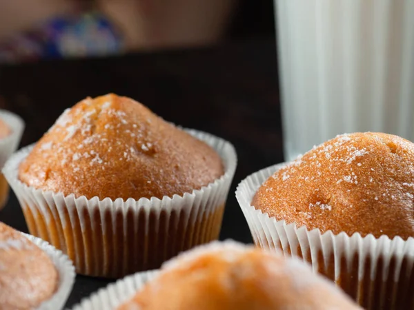 Some juicy tasty muffins stuffed cupcakes. dark background — Stock Photo, Image