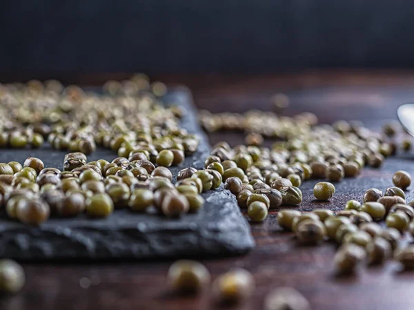 Mash soy bean grains are on the surface of the shale.