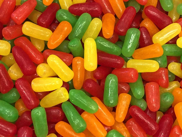 Many Brightly Colored Bean Shaped Chewy Candy Top View Flat — Stock Photo, Image