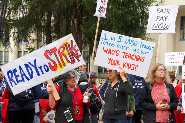 Oakland, CA - January 18, 2019: Oakland teachers having a one day "sick out" to protest slow progress on contract talks with the district. Fighting for smaller class sizes and bigger paychecks.