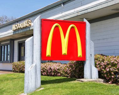 Alameda, CA - April 13, 2019: McDonalds sign close up. McDonalds is the worlds largest restaurant chain in terms of revenue, serving over 69 million customers daily in over 100 countries.