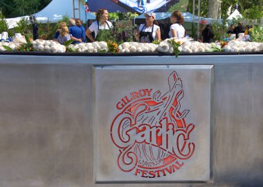 Gilroy, CA - July 27, 2019: Unidentified participants at the 41st annual Garlic Festival, one of the largest annual food festivals in the United States entertaining thousands of visitors annually. clipart
