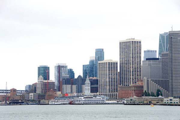 San Francisco, CA - August 19, 2019: San Francisco Financial District skyline, view from water. A popular international tourist destination, and tourism has become the backbone of the city's economy.