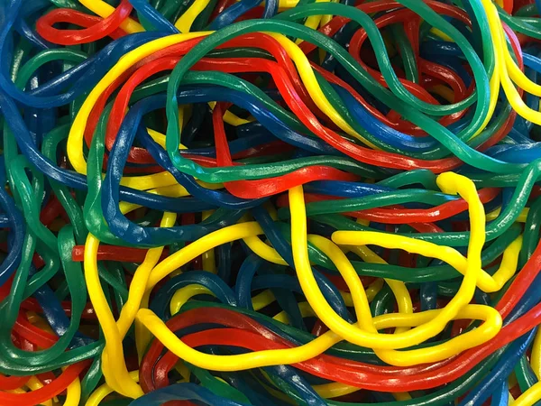 Background of candy string licorice in many colors.