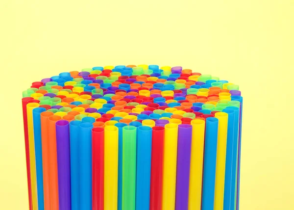 Hundreds Colorful Plastic Straws Laying Yellow Surface Yellow Background Facing — Stockfoto