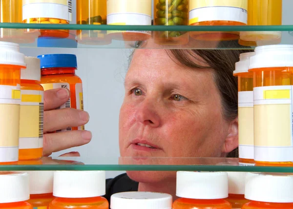 Middle Aged Caucasian Woman Reading Medication Label Prescription Bottle Medicine — Stock Photo, Image