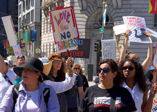 San Francisco, CA - June 30, 2018: Thousands of protestors in a "Families Belong Together" march to City Hall, protesting Trump's "Zero Tolerance" policy and the separation of more that 2,000 children
