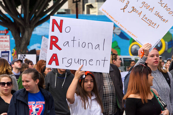 Los Angeles, CA - March 24, 2018: With calls to End gun violence, no more silence!  thousands of students and adults march to protest gun violence. March for our lives.