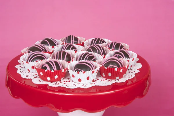 Chocolate cake balls in red and white polka dot mini cup cake li — Stock Photo, Image