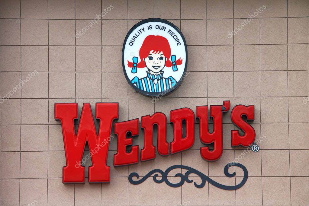 Oakland, CA - December 06, 2016: Wendy's fast food restaurant close up on sign. Wendy's is the world's third largest hamburger fast food chain with approximately 6,650 locations.