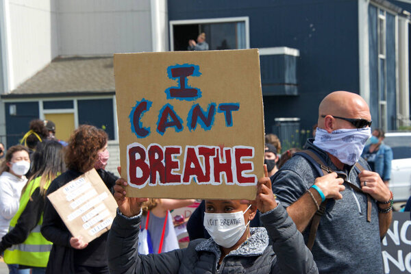 Alameda, CA - June 5, 2020: Protestors participating in  the George Floyd Black Lives Matter protest in Alameda, marching from Encinal High School to City Hall for a rally.