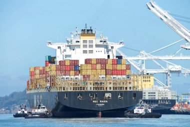 Oakland, CA - August 7, 2020: Cargo Ship MSC RANIA entering the Port of Oakland, the fifth busiest port in the United States. clipart