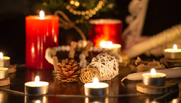 Images of candles and sacred wood to perform magic rituals and mysteries about superstition. Concept Divine magic & occultism on the old wooden table.