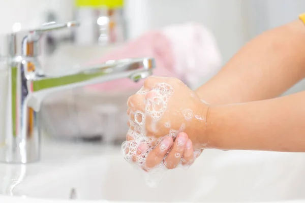 washing hands in a hospital or home with liquid soap mixed with antiseptics. prevent Viruses covid19 and antibacterial concept of caring for the cleanliness of hand washing.