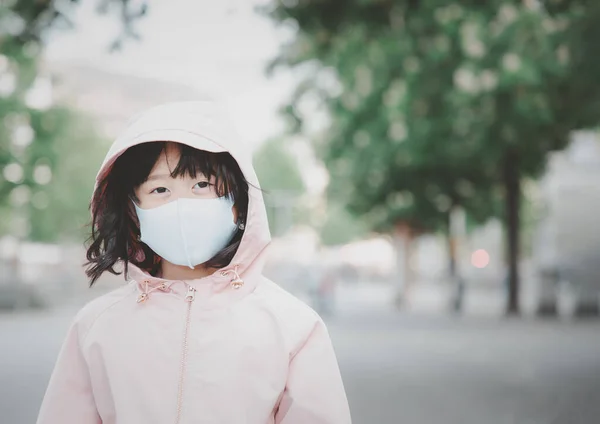 face  Children Wearing a  cloth mask with Family to prevent germs, toxic fumes, and dust. Prevention of bacterial infection coronavirus Corona virus or Covid 19 in the air in a white background