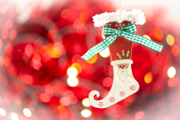 Merry Christmas holiday with star and red hearts , toy socks, Merry Christmas and happy New Year and Family happiness festival on red bokeh background Beautiful decorations