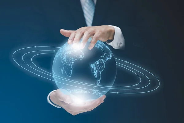 Businessman holds the earth connect to people icon of a media screen, Technology Process System Business concept.