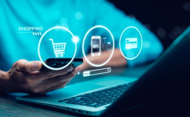 NFC or Near Field Communication  concept. Payment for goods and services via a reader or signal receiver.  Data exchange between devices. Transmission and reception of data without the use of cables.