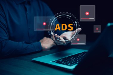 A cybersecurity breach concept showing a hacker attacking a system with a System Hacked warning on a digital screen. 