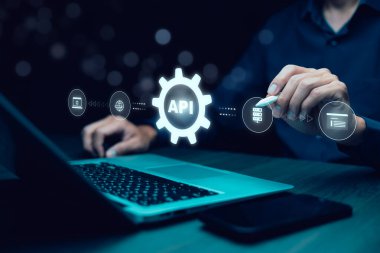 A cybersecurity breach concept showing a hacker attacking a system with a System Hacked warning on a digital screen. 