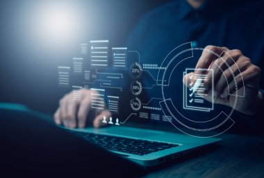 Digital workflow automation concept. A businessman using a laptop interacts with a virtual checklist and data analytics interface, symbolizing task management, and efficient business operations.