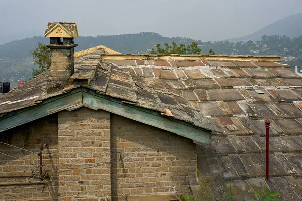 25 Sep 2009 A quaint, old structure with stone walls,chimney roof slanting stone roofs  Almora Uttarakhand Uttranchal India