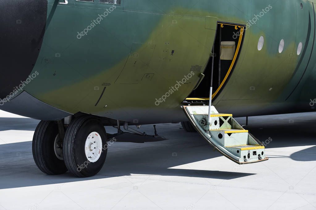 Detail of a military Hercules airplane on the runway