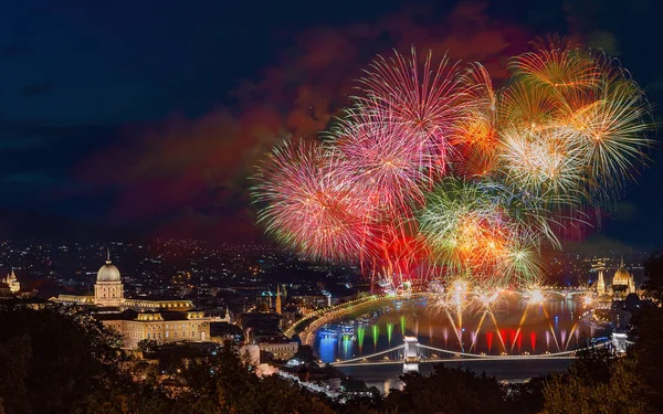 State Foundation Day fireworks 2022 20th August. Celebration fireworks over Danube river in Budapest, Hungary. Buda castle on the left side  Chain bridge on bottom and Hungarian parliament on right.