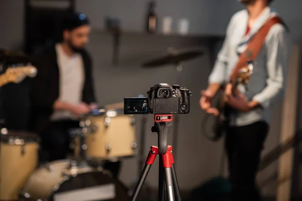 music group bassist, lead guitarist and drummer conduct online broadcast of the concert from their Studio, record a video for the blog.