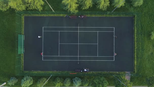 Players Play Tennis Green Court Aerial — Stock Video