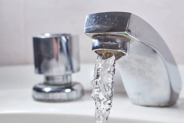 Faucet and water Open water tap.