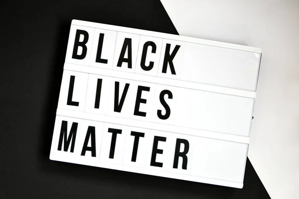 BLACK LIVES MATTER text on a black and white background. Freedom of Speech Vintage Retro quote board. Protest against the end of racism, anti-racism, equality. Poster on violation of human rights