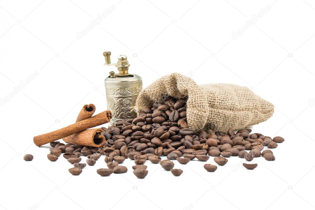 Coffee sack with beans, grinder and cinamon. Isolated coffee bag on white background. Coffee beans isolated.