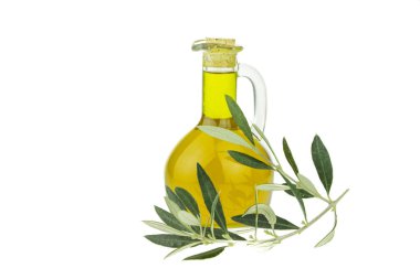 Zeytin yağı şişesi ve zeytin dalı uzatılmış kase. Bakir zeytinyağı. Doğal zeytinyağı, sağlıklı yiyecekler. Doğal Akdeniz yiyeceği. Ekmek batırma.