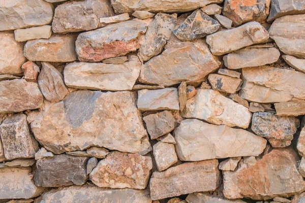 Background of stone wall texture photo. Greek ancient wall texture. Pattern of stone wall decorative surfaces.