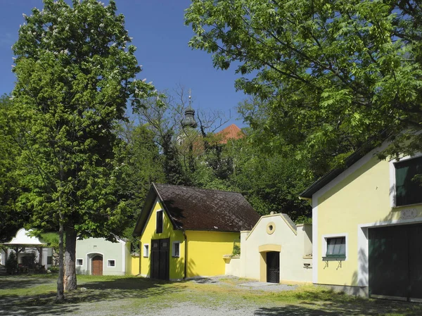 Austria, wine cellars and church, springtime in rural village Reisenberg in Lower Austria