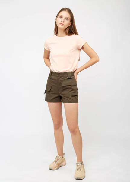 Teenager girl in khaki cargo shorts — Stock Photo, Image