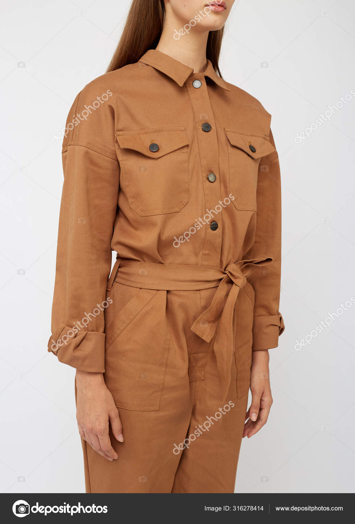 Girl in camel color jumpsuit on white backround. — Stock Photo ...