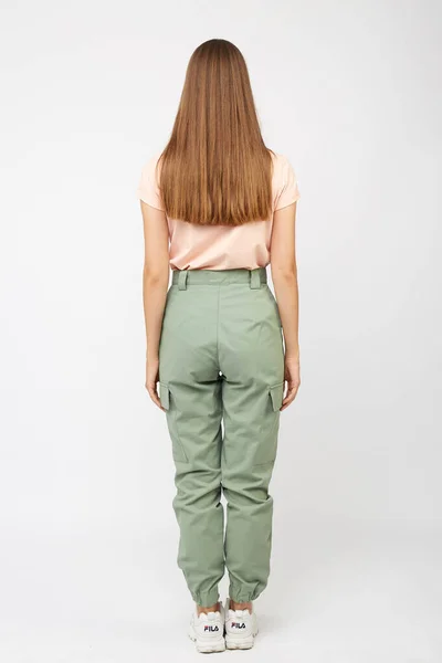 Girl in green cargo pants and a t-shirt — Stock Photo, Image