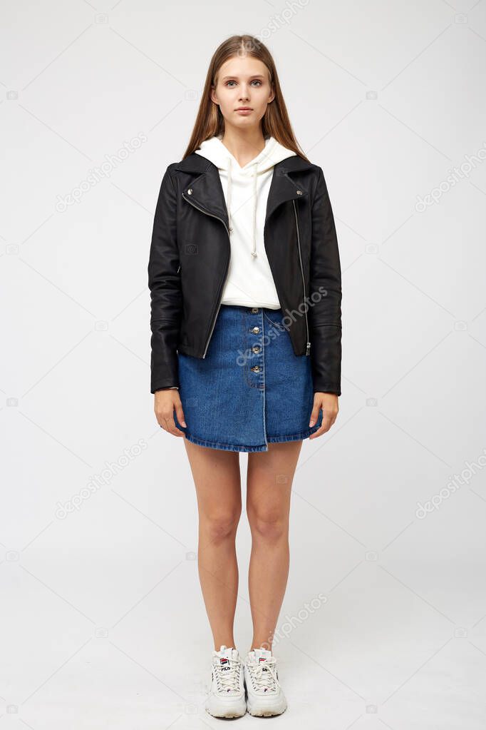 girl in a denim skirt and a black jacket