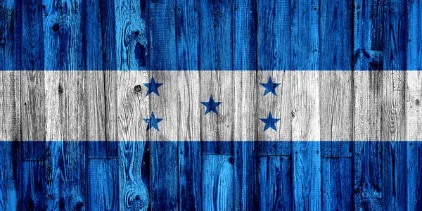 Tahta çitlerin üzerine boyanmış Honduras bayrağı