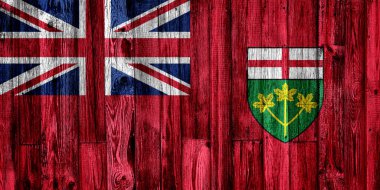 Ahşap arka planda Ontario bayrağı, yakın plan.