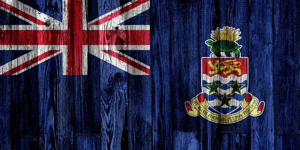 在木制背景和特写上开曼群岛国旗 — 图库照片