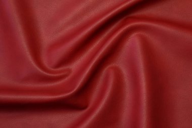 Pvc tabanında dalgalar ve kıvrımlar olan kırmızı yapay deri